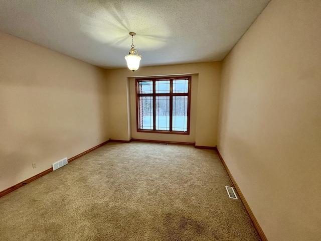 unfurnished room with carpet flooring