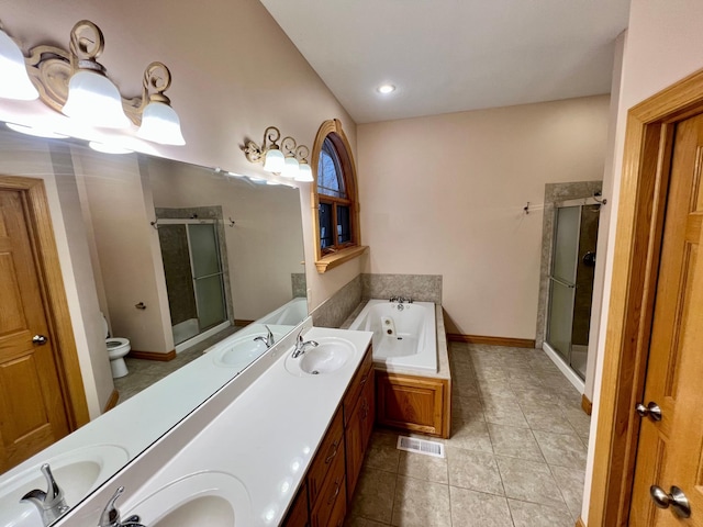 full bathroom with tile patterned floors, vanity, and shower with separate bathtub