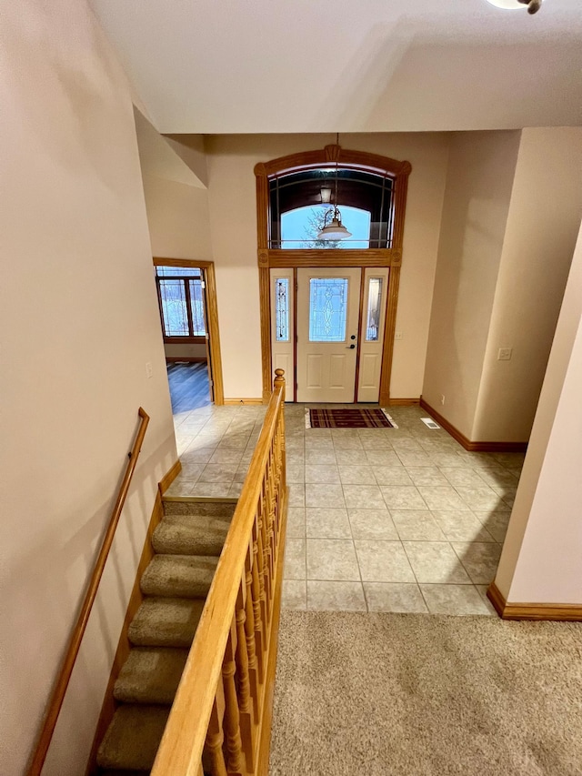 entrance foyer with light tile patterned floors