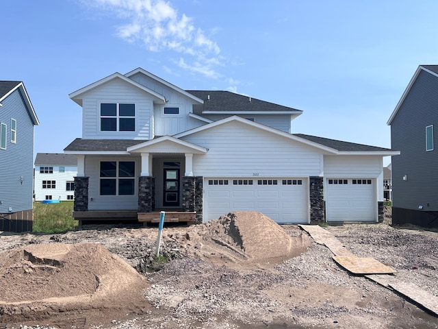 view of front of property with a garage