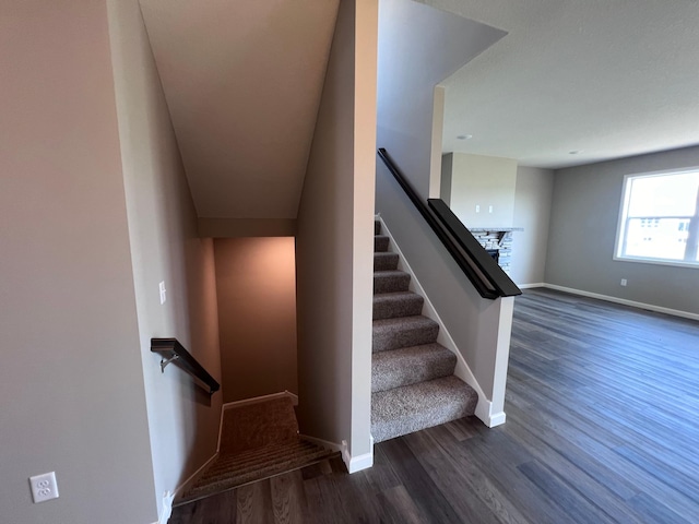 staircase with wood-type flooring