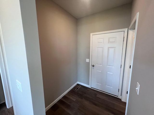 doorway with dark hardwood / wood-style flooring