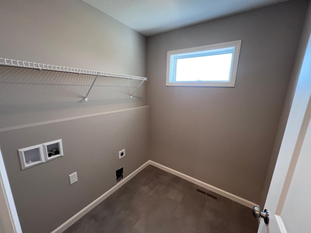 clothes washing area featuring hookup for an electric dryer and washer hookup