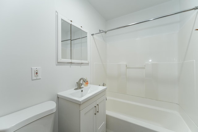 full bathroom with vanity,  shower combination, and toilet