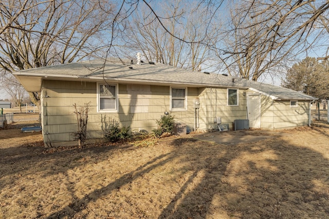 view of side of property featuring central air condition unit