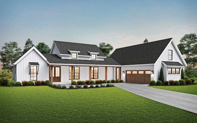 view of front of home featuring a front yard and a garage