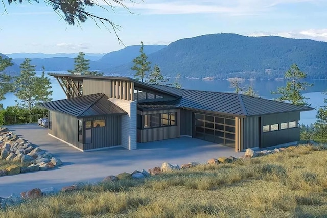 view of front facade with a mountain view and a garage