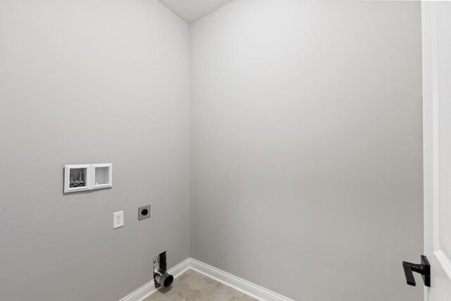 laundry room featuring hookup for a washing machine, a textured ceiling, and hookup for an electric dryer