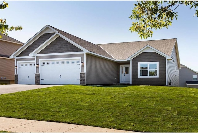 view of front of house with a garage and a front yard