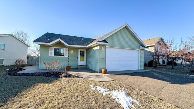 ranch-style home with a garage