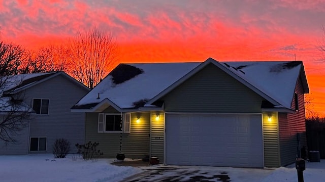 view of front of property with a garage