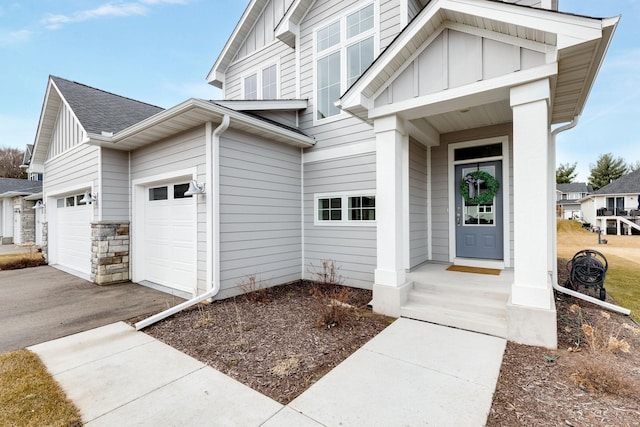 view of exterior entry with a garage