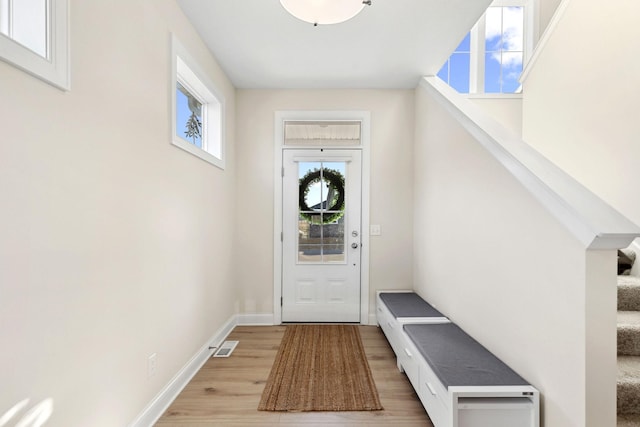 doorway to outside featuring wood-type flooring