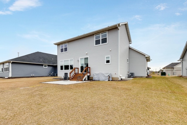 back of house with a lawn, central AC, and a patio