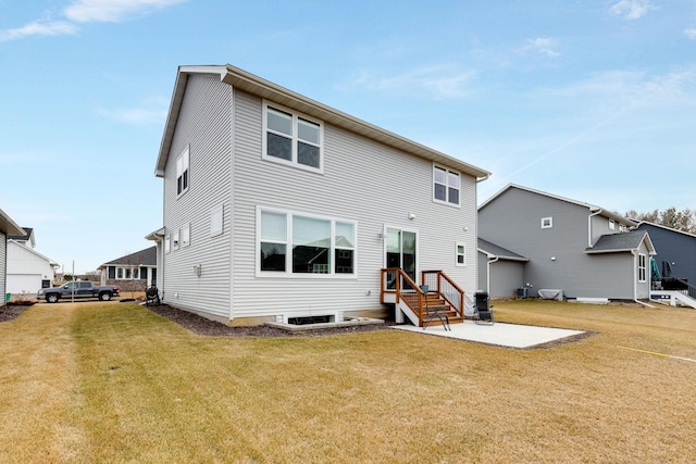 back of property featuring a lawn and a patio area