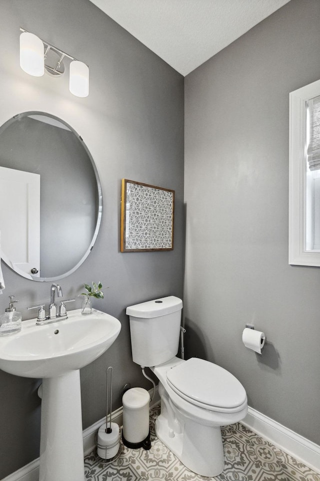 bathroom with tile patterned floors and toilet