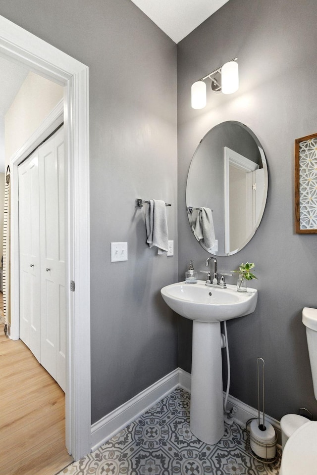 bathroom with tile patterned flooring and toilet