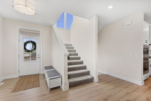 entryway with light hardwood / wood-style flooring