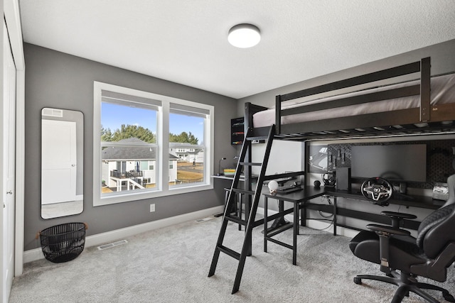 bedroom with light carpet and a closet