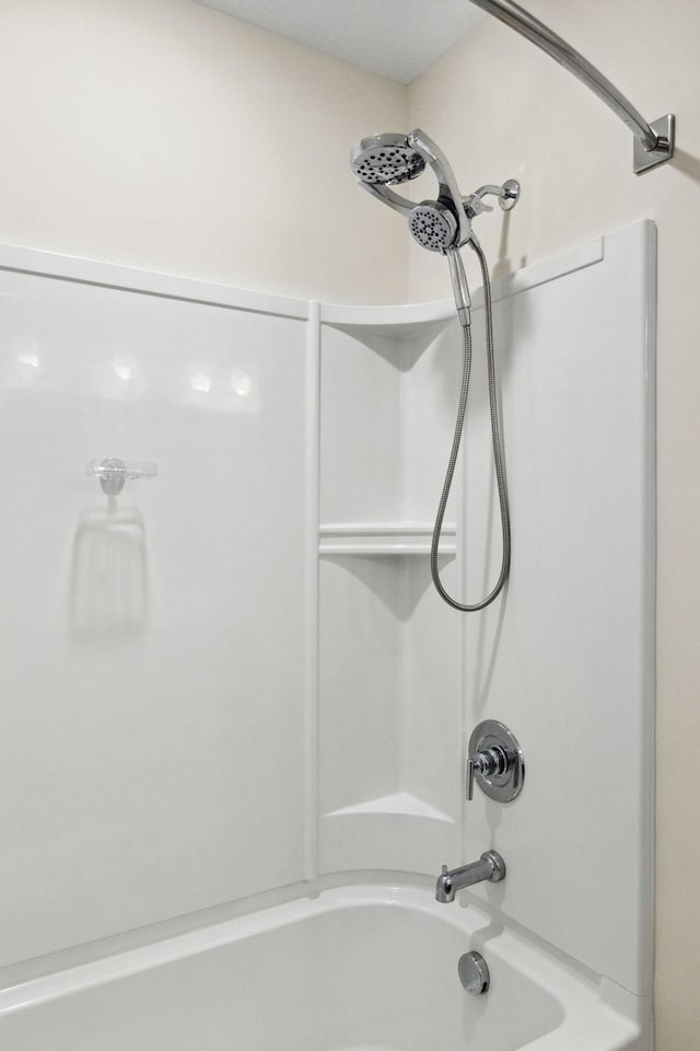 bathroom featuring  shower combination