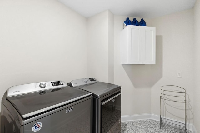 clothes washing area with washer and dryer