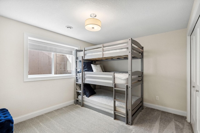 unfurnished bedroom with carpet floors and a closet