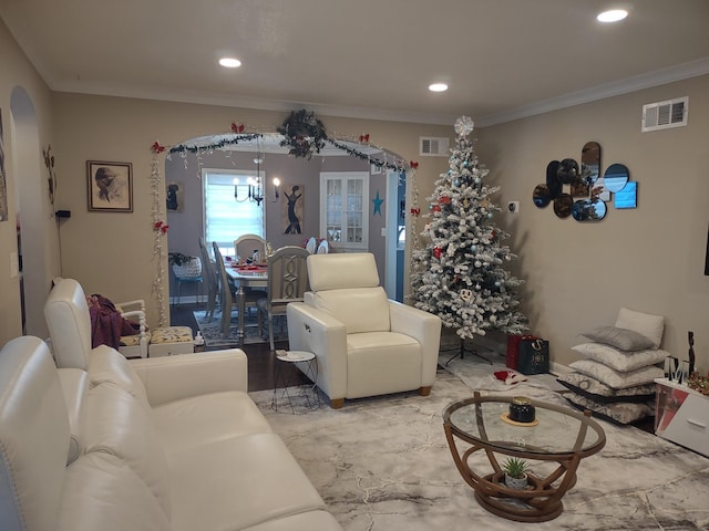 living area featuring a chandelier, arched walkways, visible vents, and recessed lighting