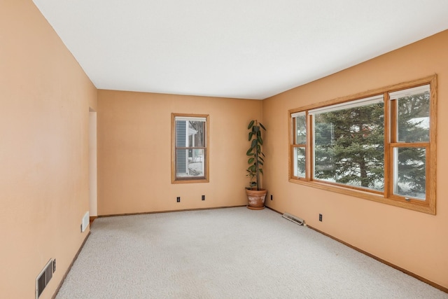 empty room with light colored carpet