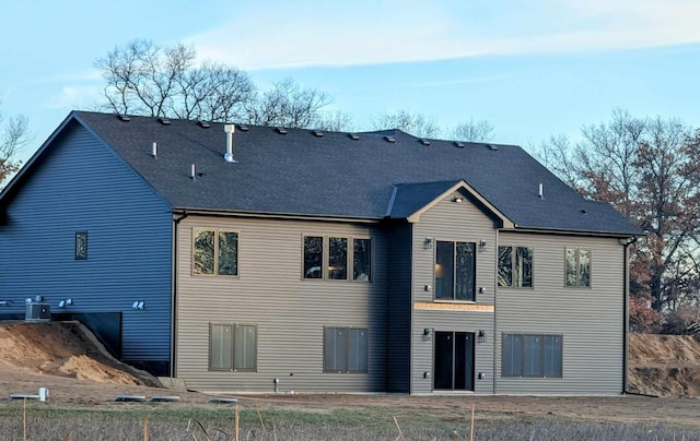 back of house featuring central AC