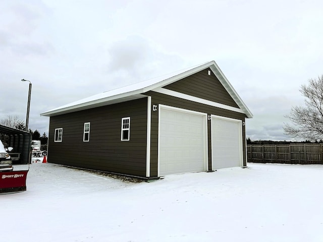 view of snow covered garage