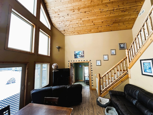 living room featuring wooden ceiling, hardwood / wood-style floors, and high vaulted ceiling