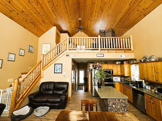 living room featuring ceiling fan, sink, wood ceiling, dark wood-type flooring, and high vaulted ceiling