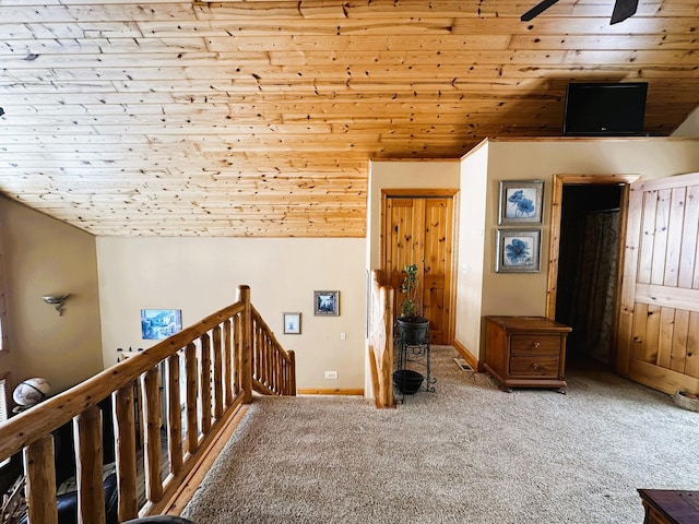 bonus room featuring light carpet, vaulted ceiling, wood ceiling, and ceiling fan