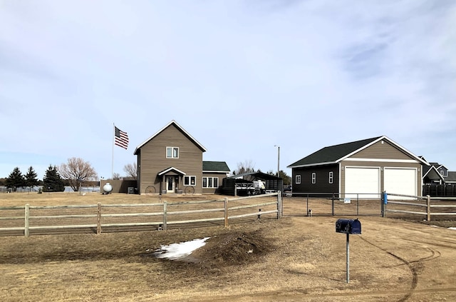 view of front of property with an outdoor structure, fence, and a garage