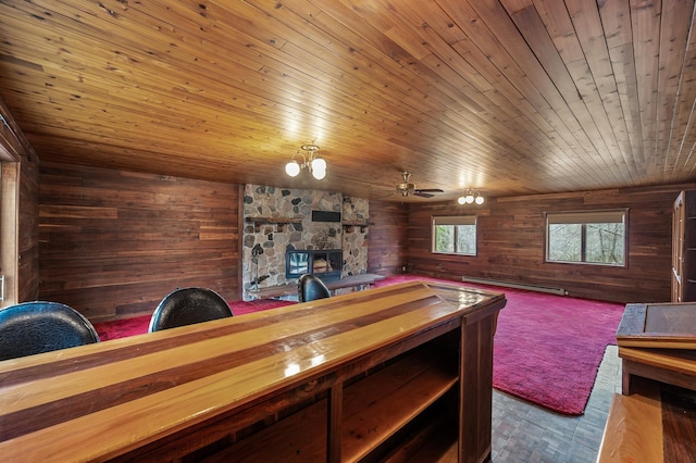 bar featuring a baseboard radiator, wooden ceiling, butcher block countertops, wood walls, and ceiling fan with notable chandelier