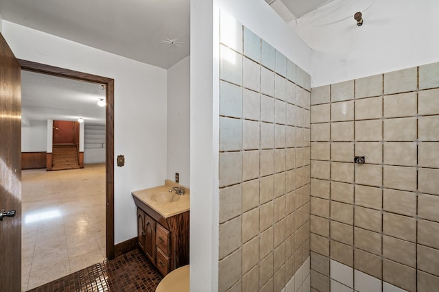 bathroom with tile patterned flooring and vanity