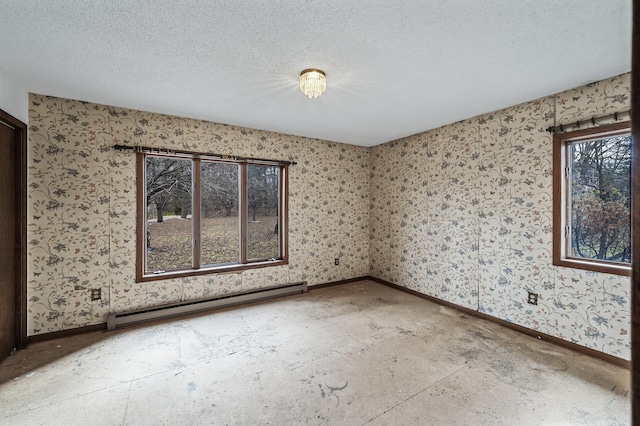 empty room featuring a textured ceiling and a baseboard radiator