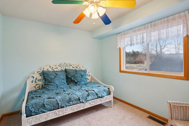 carpeted bedroom with ceiling fan