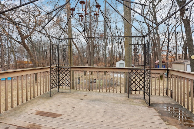 deck featuring a storage shed