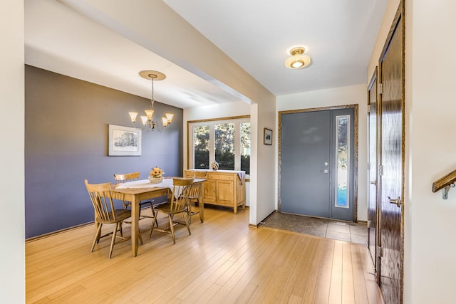 foyer with a chandelier and light hardwood / wood-style flooring