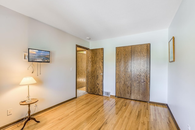 unfurnished bedroom featuring light hardwood / wood-style flooring