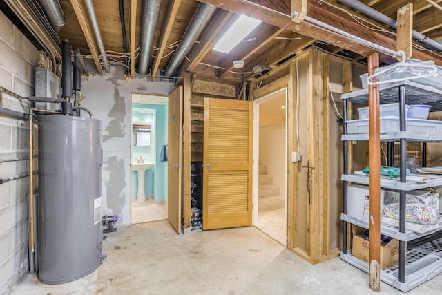 basement with sink and electric water heater