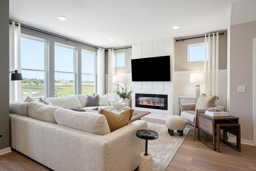 living room featuring light hardwood / wood-style flooring and plenty of natural light