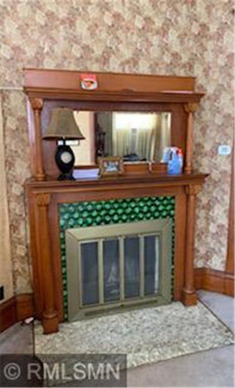 room details with concrete floors and a fireplace