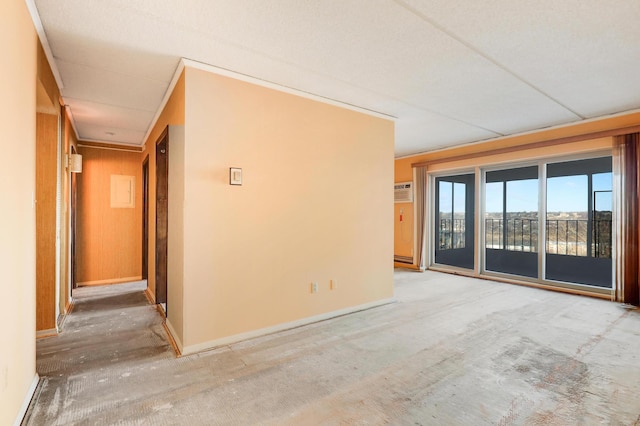 unfurnished room featuring wood walls