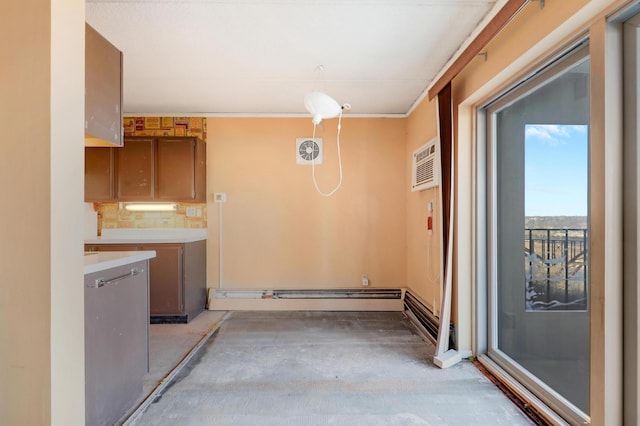 interior space featuring tasteful backsplash, hanging light fixtures, a wall mounted AC, and a baseboard heating unit