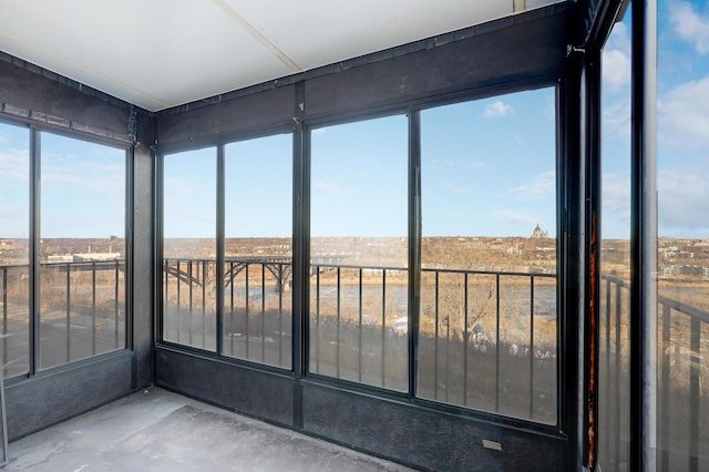 unfurnished sunroom featuring a rural view