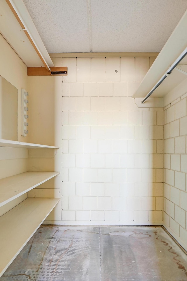 basement featuring a textured ceiling