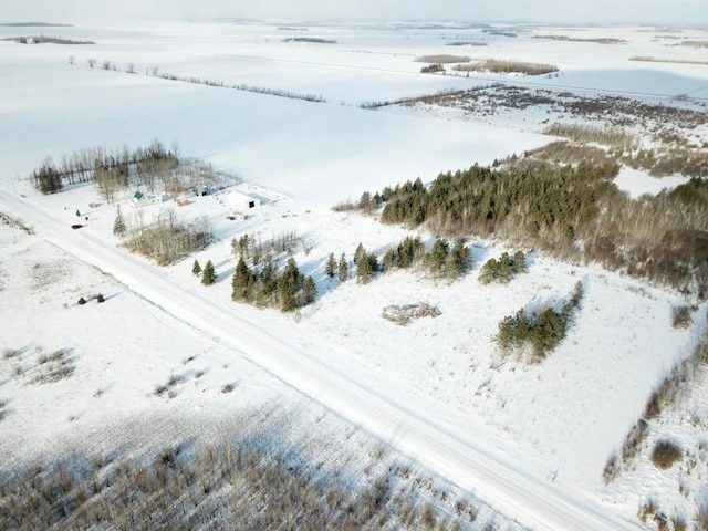 snowy aerial view with a rural view