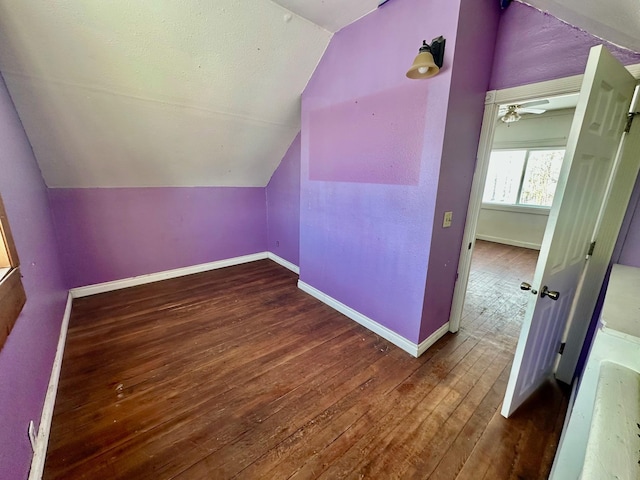 bonus room with hardwood / wood-style floors, ceiling fan, and lofted ceiling